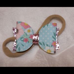 Pink floral hair bow on nylon